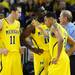 Michigan head coach John Beilein chats with freshman Nik Stauskas, junior Tim Hardaway Jr. and sophomore Trey Burke on the sideline during the first half against North Carolina State at Crisler Center on Tuesday night. Melanie Maxwell I AnnArbor.com